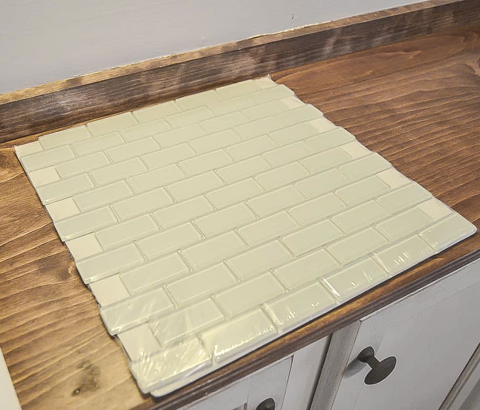 If you want to add a backsplash but have never done it before, this DIY Tile Backsplash is for you.