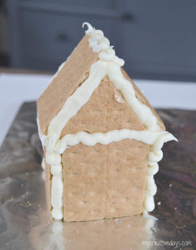Are you looking for an simple way to make a Gingerbread House? I found the easiest way to make a Gingerbread House that the kids can even do!