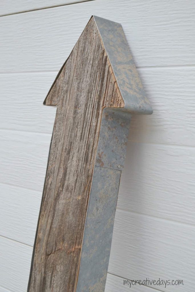 Do you love barn wood? This DIY Barn Wood Arrow Tutorial will show you how to take your favorite wood and make it into a statement piece for your home.