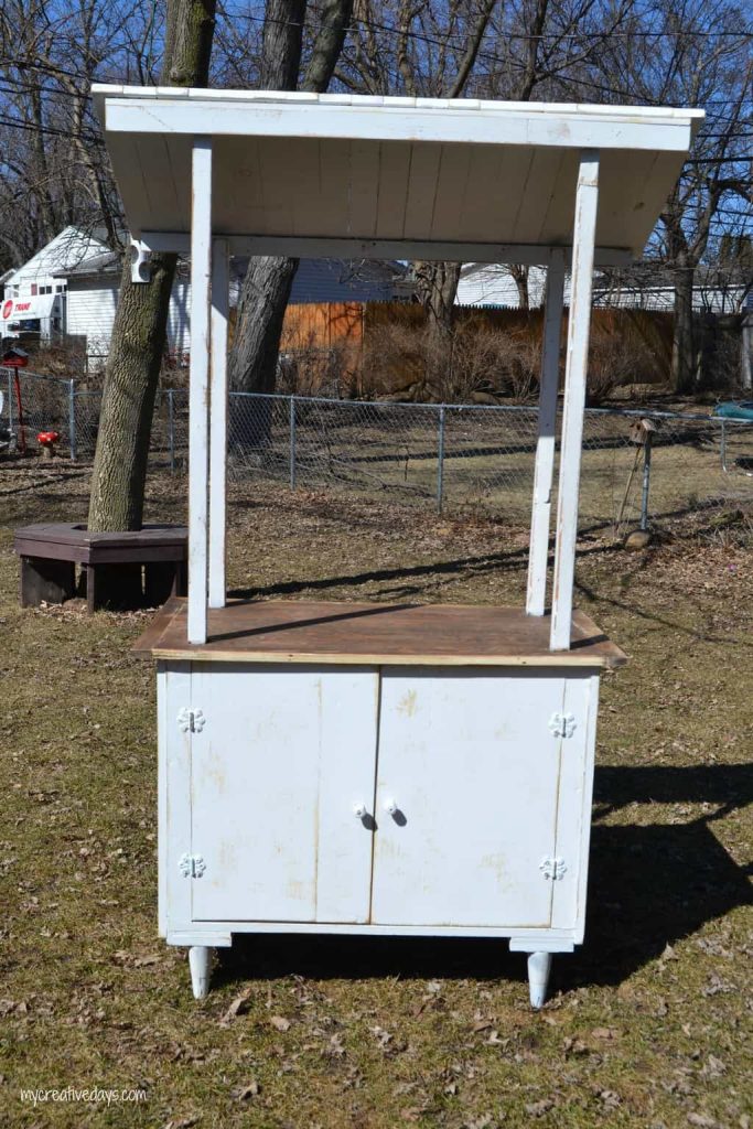 Looking for a lemonade stand for the kids this summer? This DIY Lemonade Stand repurposes an old cabinet into a fun stand for the kids to use for all their lemonade and bake sale stands.