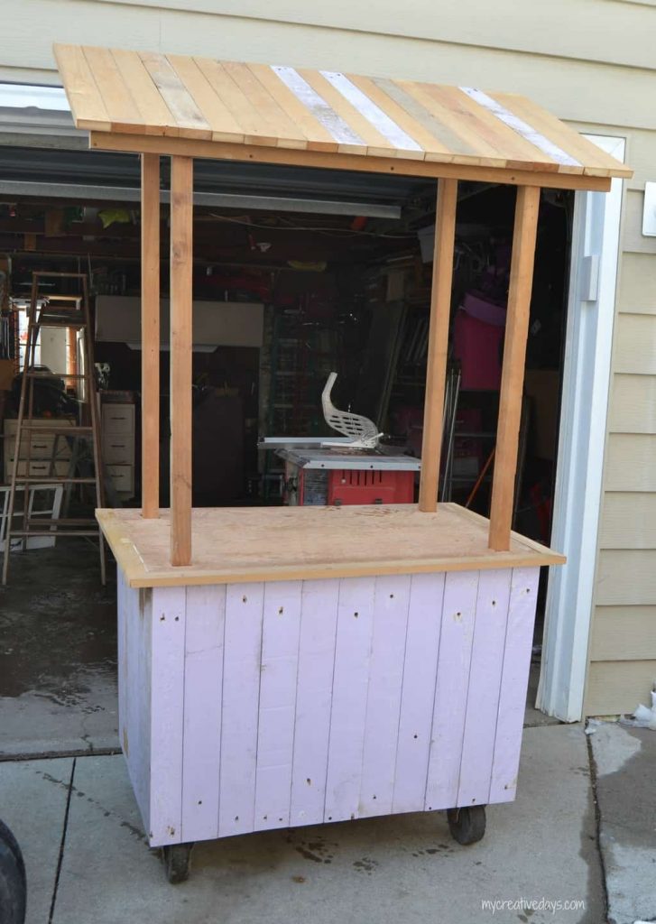 Looking for a lemonade stand for the kids this summer? This DIY Lemonade Stand repurposes an old cabinet into a fun stand for the kids to use for all their lemonade and bake sale stands.