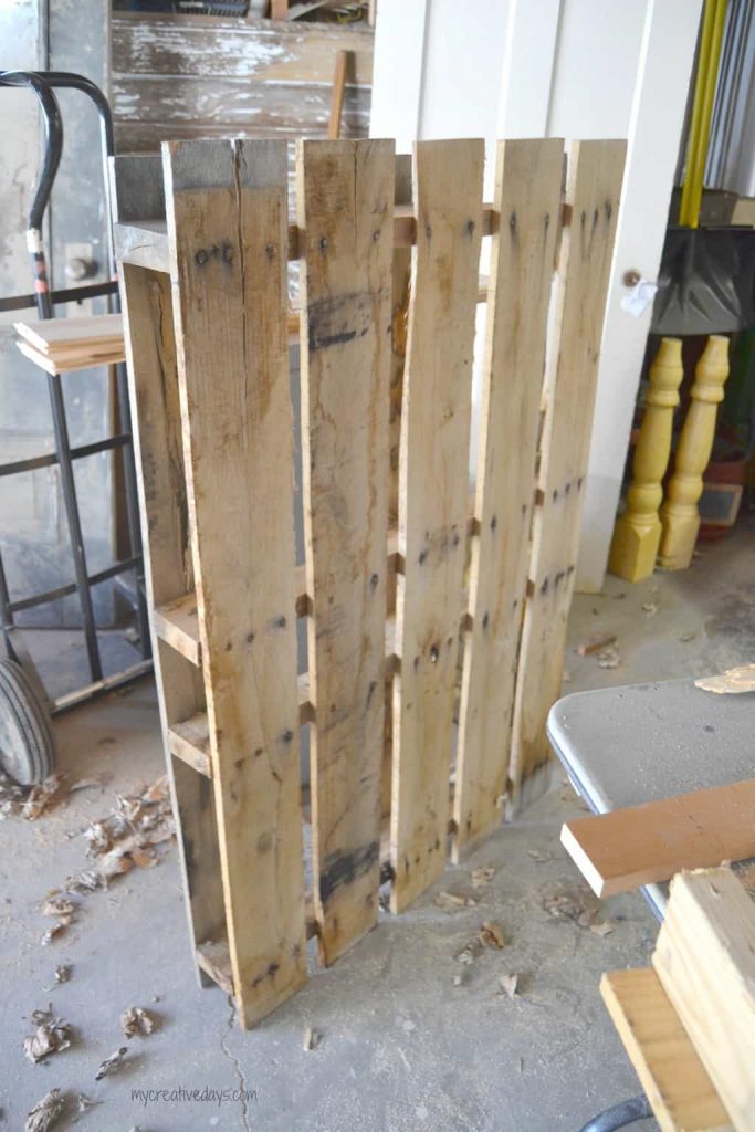 This Reclaimed Pallet Wood Organizer is easy to make and can be used to organize all kinds of things in your home.