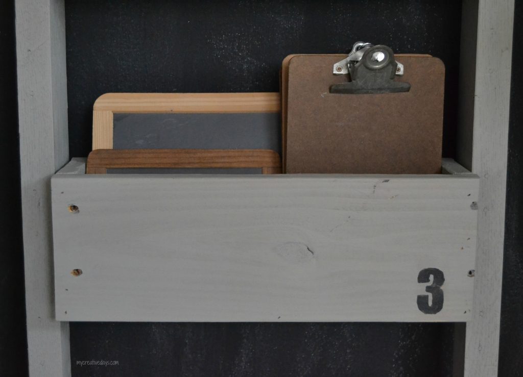 This Reclaimed Pallet Wood Organizer is easy to make and can be used to organize all kinds of things in your home.