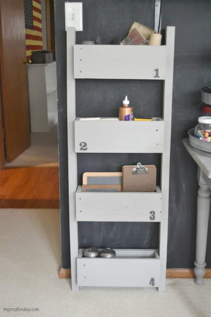 This Reclaimed Pallet Wood Organizer is easy to make and can be used to organize all kinds of things in your home.