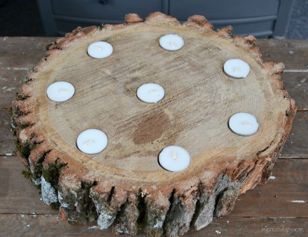 Do you like the look of rustic wood? This DIY Wood Slice Centerpiece is rustic and adds a beautiful statement wherever you place it.