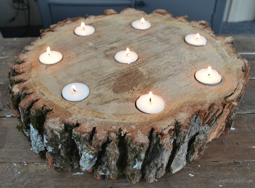 Do you like the look of rustic wood? This DIY Wood Slice Centerpiece is rustic and adds a beautiful statement wherever you place it.