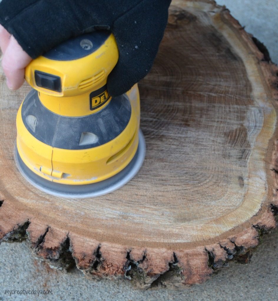 Do you like the look of rustic wood? This DIY Wood Slice Centerpiece is rustic and adds a beautiful statement wherever you place it.