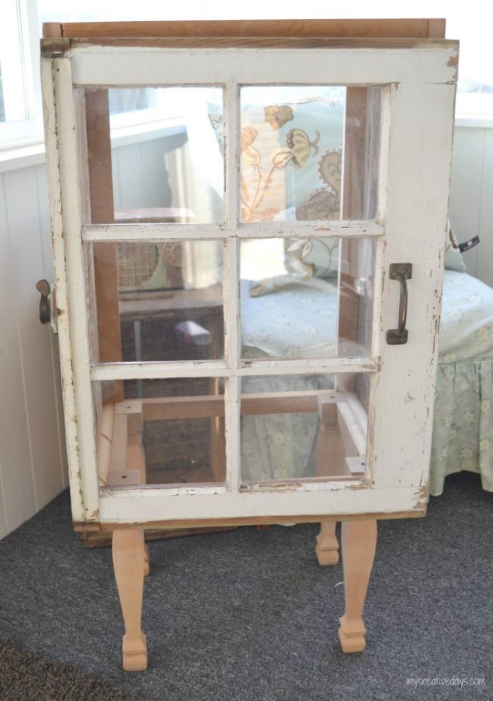 Do you love old windows and have a few on hand? Make a DIY Window Cabinet to make them functional and highlight them in a new way!