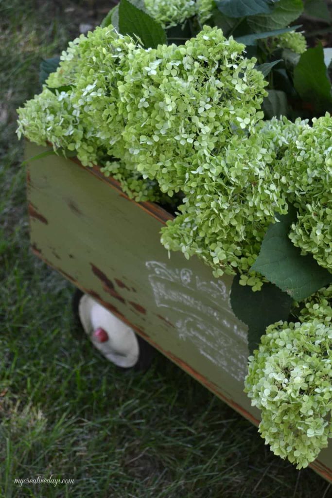 Wagons come in all shapes and sizes and this DIY wagon tutorial will show you how to turn your basic wagon into a beautiful piece for your garden or porch!