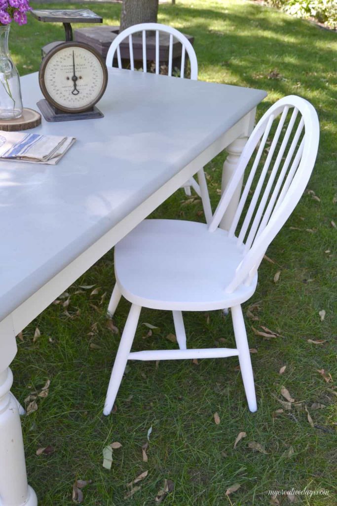 Are you looking for a farmhouse kitchen table and chairs? Search local yard sales and customize a set like we did with this one.