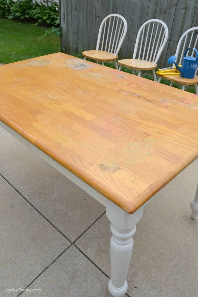 Are you looking for a farmhouse kitchen table and chairs? Search local yard sales and customize a set like we did with this one. 