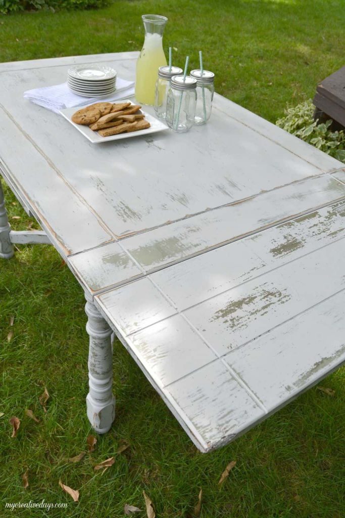 Farmhouse tables come in all shapes, colors and sizes. This small farmhouse table was an avocado green color, but we toned it down and made it chippy with touches of the green color popping through.