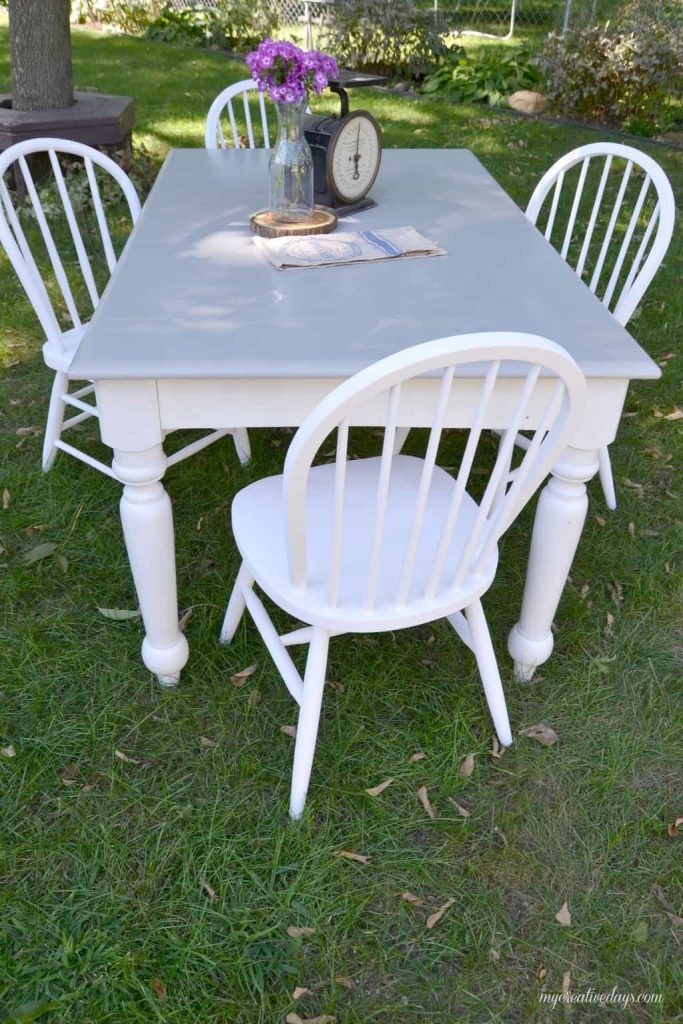 Are you looking for a farmhouse kitchen table and chairs? Search local yard sales and customize a set like we did with this one.