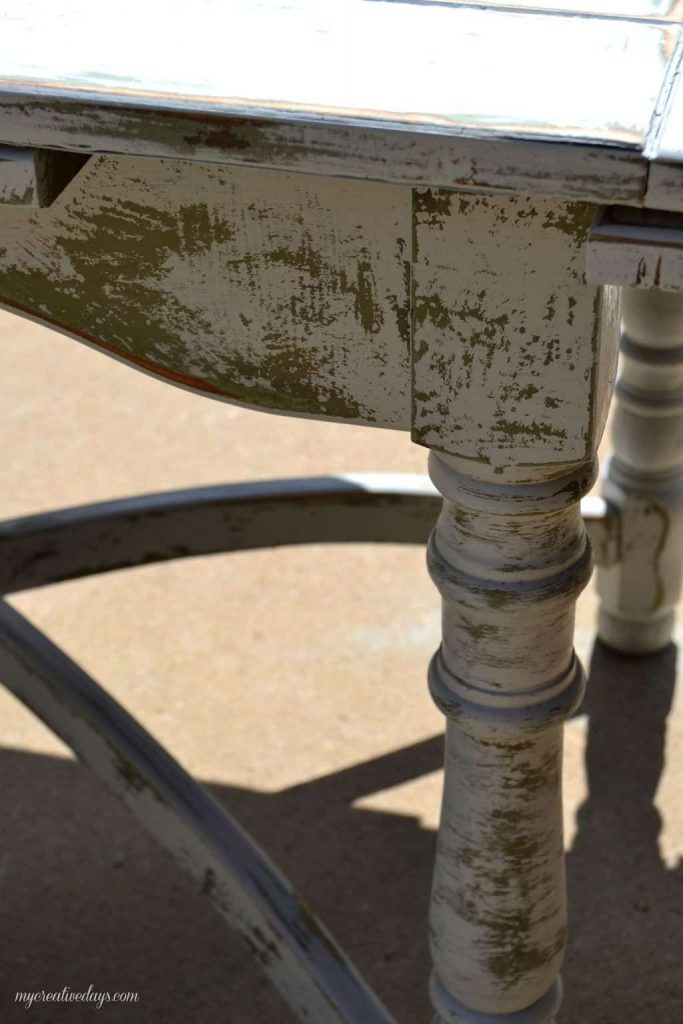 Farmhouse tables come in all shapes, colors and sizes. This small farmhouse table was an avocado green color, but we toned it down and made it chippy with touches of the green color popping through.