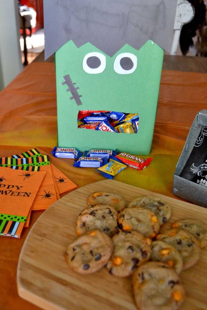 Are you looking for a fun way to hand out candy this Halloween? Make this easy DIY Frankenstein Halloween candy dispenser from an empty cereal box!