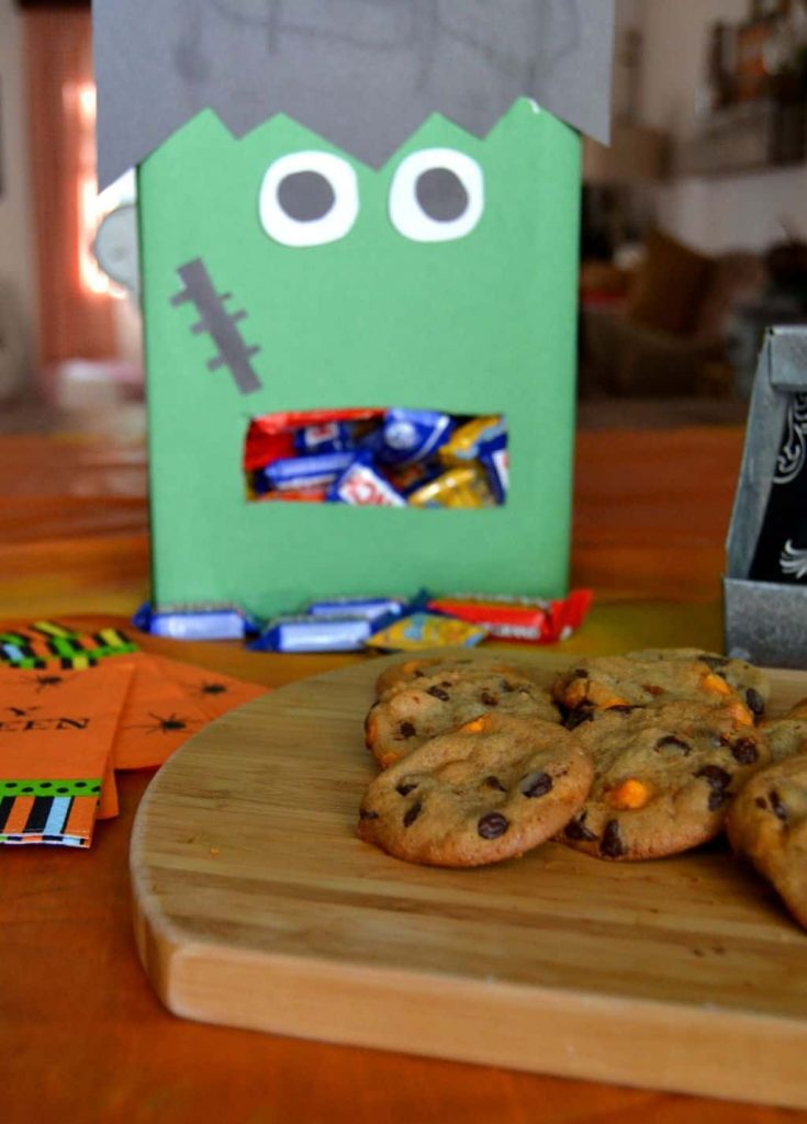 Are you looking for a fun way to hand out candy this Halloween? Make this easy DIY Frankenstein Halloween candy dispenser from an empty cereal box!