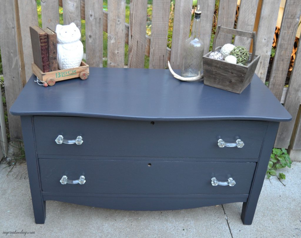 Do you have a small dresser that is in need of a makeover? This small black dresser makeover was so easy to do and I was able to salvage the vintage glass pulls!