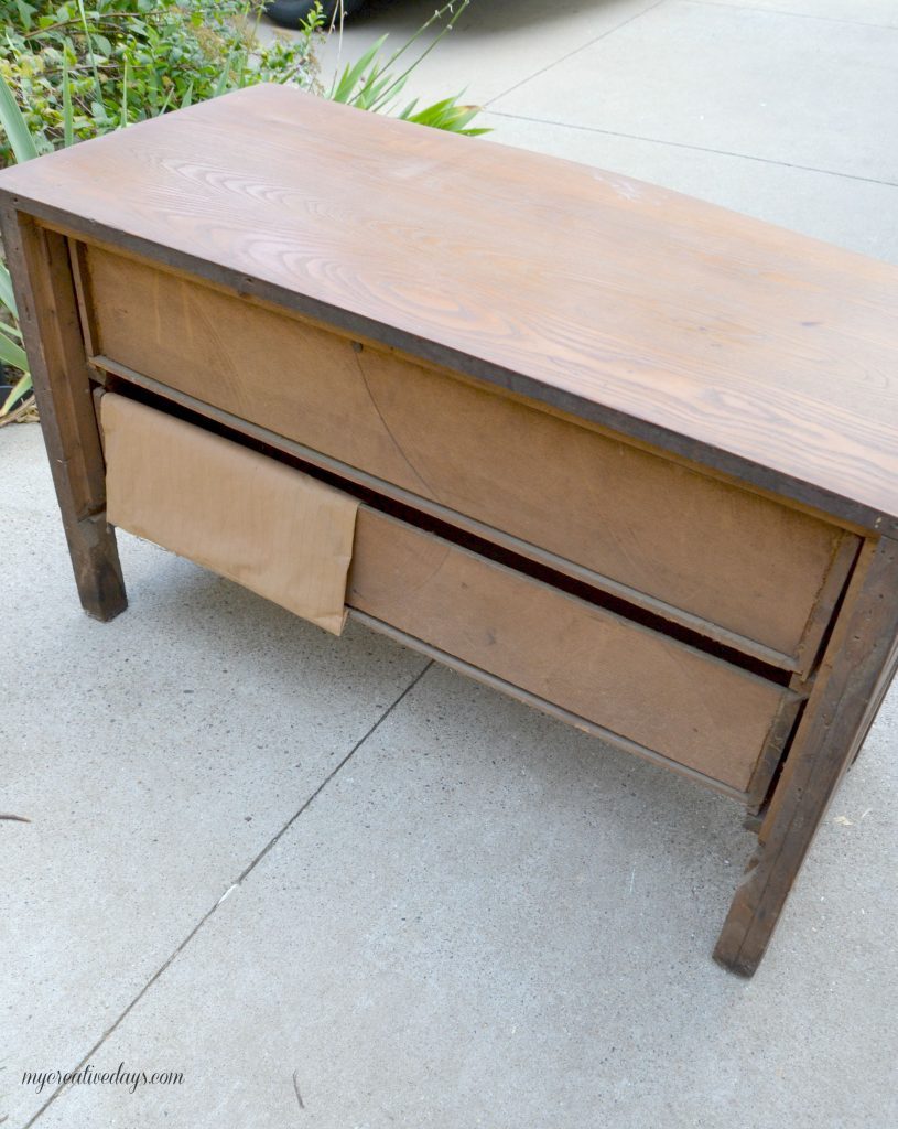 Do you have a small dresser that is in need of a makeover? This small black dresser makeover was so easy to do and I was able to salvage the vintage glass pulls!