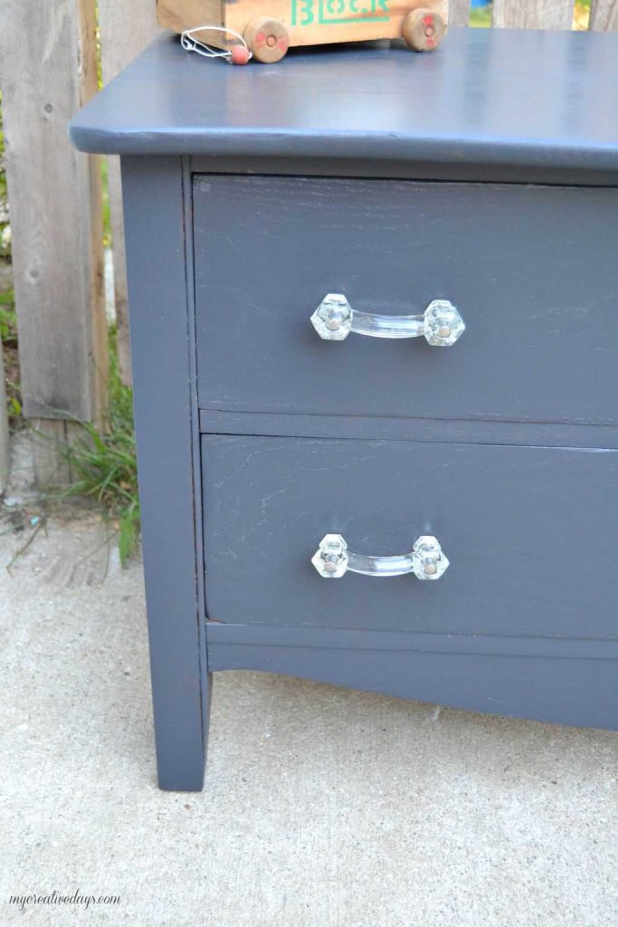 Do you have a small dresser that is in need of a makeover? This small black dresser makeover was so easy to do and I was able to salvage the vintage glass pulls!