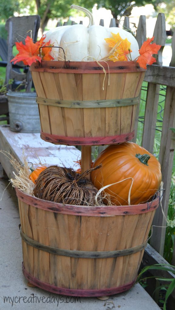 If you are looking for easy DIY Fall Decor Tutorial for your home, click over to see how to make this cute tiered bushel basket to fill with pumpkins and gourds.