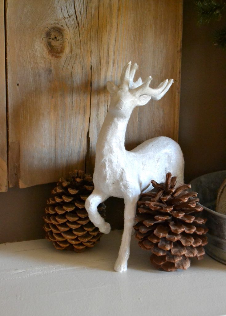 Decorating A Christmas Mantel does not have to be hard. Click over to see how to put together an easy and rustic Christmas mantel in no time. 