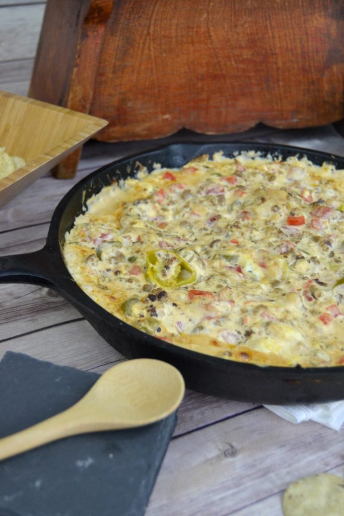 Looking for a cheesy dip to serve at your next party? Click over to get this easy for a Zesty Sausage Cream Cheese Dip your guests will love!