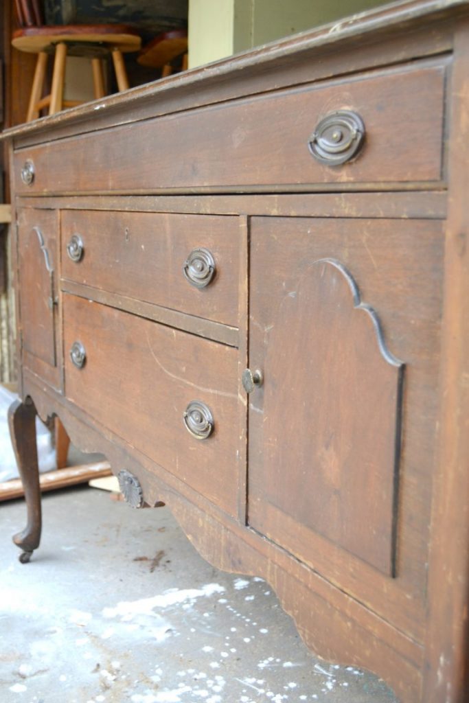 If you have an antique buffet that is in need of a makeover, click over to see how easy it was to transform this antique buffet into a white distressed show stopper!