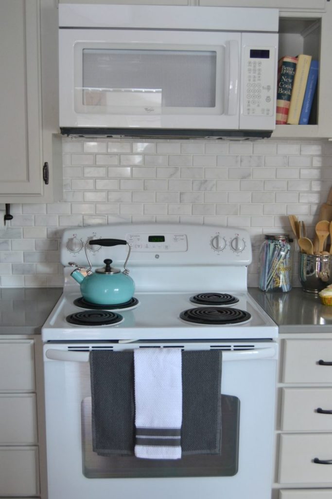 If you would like to change the look of your kitchen, but have a tight budget to work with, click over to see how we saved a lot of money on this DIY Kitchen Makeover!