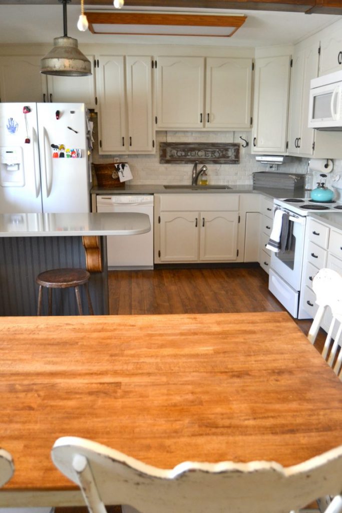If you would like to change the look of your kitchen, but have a tight budget to work with, click over to see how we saved a lot of money on this DIY Kitchen Makeover!