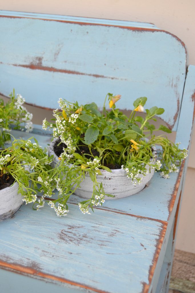 If you love to plant and welcome spring and summer with beautiful flowers and plants, click over to see how to make the cutest repurposed wood planter you ever did see. It will make your flowers sing!