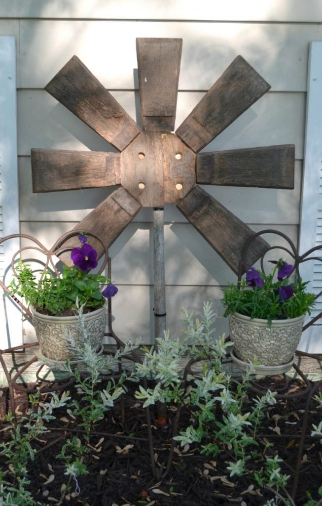 If you like to add a little art to your garden or yard, don't spend a lot of money to do it. Click over to see how easy it was to make this repurposed yard art from a broken wood barrel. 