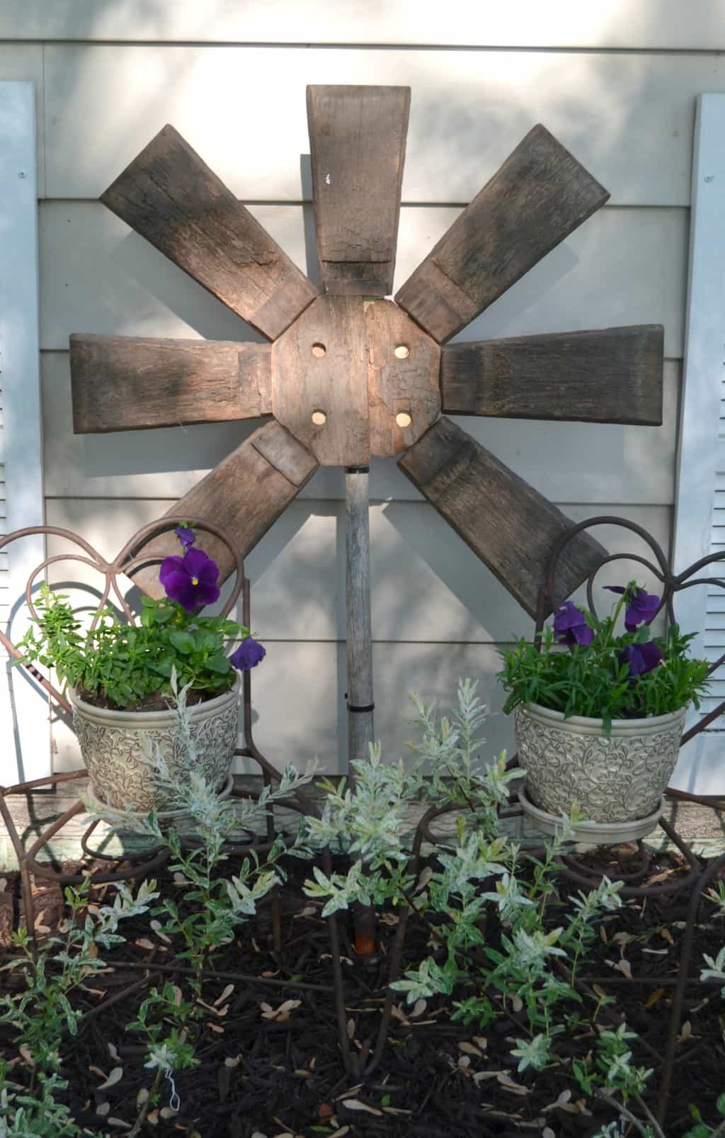 Yard Art Made From A Repurposed Broken Wood Barrel