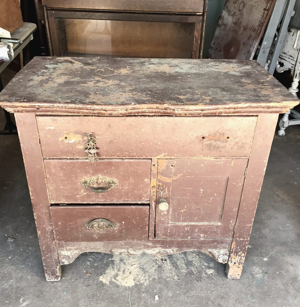 Even a wooden chest of drawers left in a garage for a long time deserves a makeover. Click over to see how I transformed this wooden chest of drawers with a technique of stain over paint. 