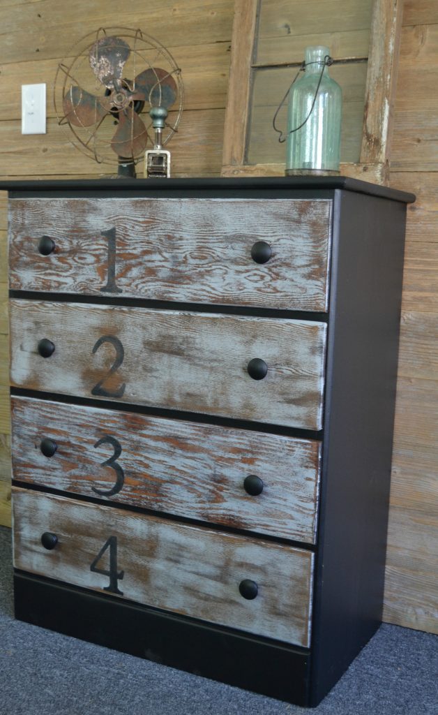 Do you love rustic touches in home decor, but don't want to spend a lot of money to get it? Click over and find this easy rustic dresser makeover that was done with stain and paint. 