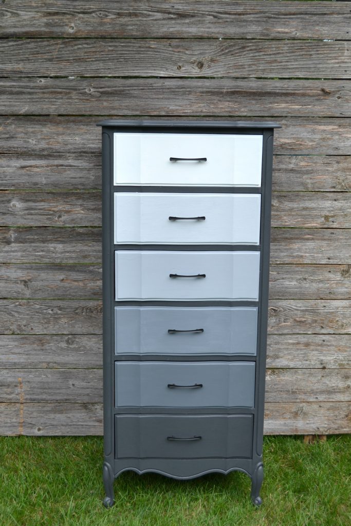 If you have an old dresser that is in need of a makeover, click over to see how easy it is to give it a gray ombre makeover in no time!