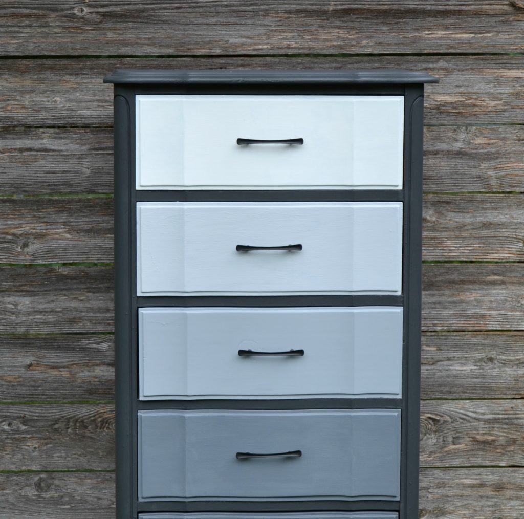 If you have an old dresser that is in need of a makeover, click over to see how easy it is to give it a gray ombre makeover in no time!