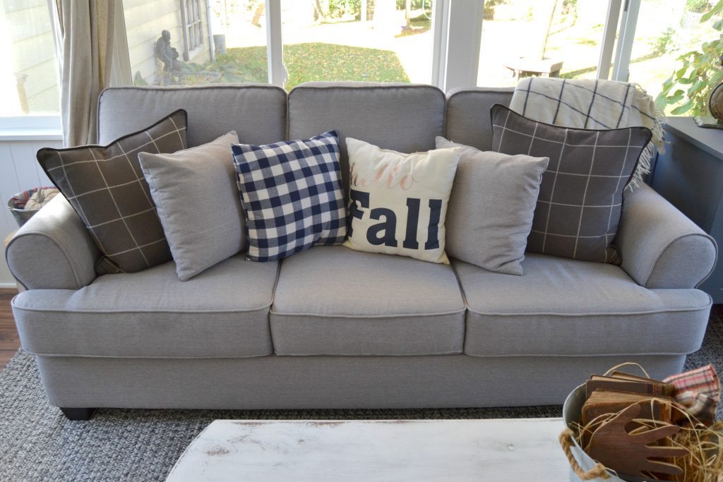 Do you have a back porch that is in need of a makeover? Click over to see how we DIY'd a back porch makeover to keep costs down and still make it a cozy spot for our family.