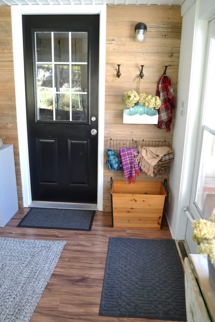 Do you have a back porch that is in need of a makeover? Click over to see how we DIY'd a back porch makeover to keep costs down and still make it a cozy spot for our family.