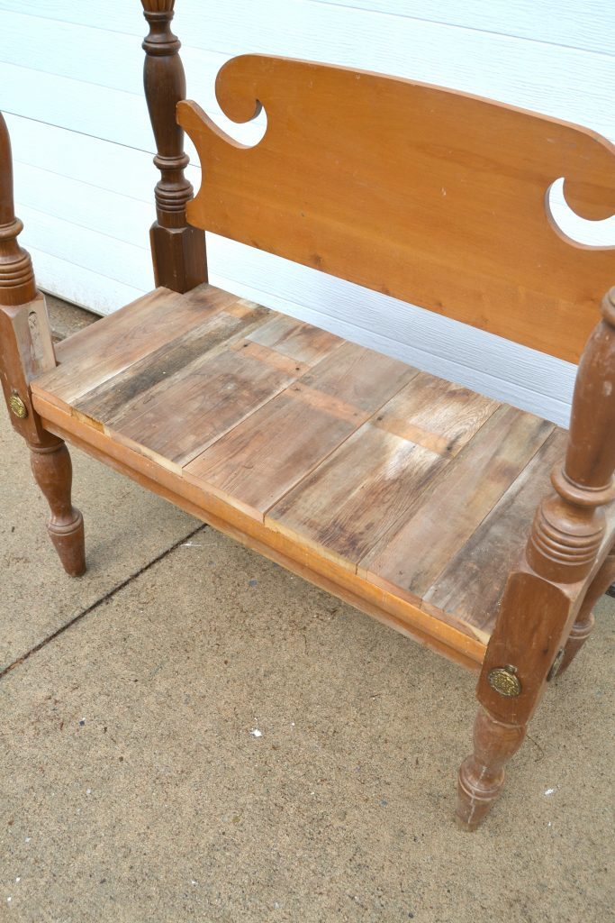 Are you looking for an entryway bench, but don't want to spend a lot of money? Click over to get the tutorial on how to repurpose a bed frame into a custom entryway bench. 