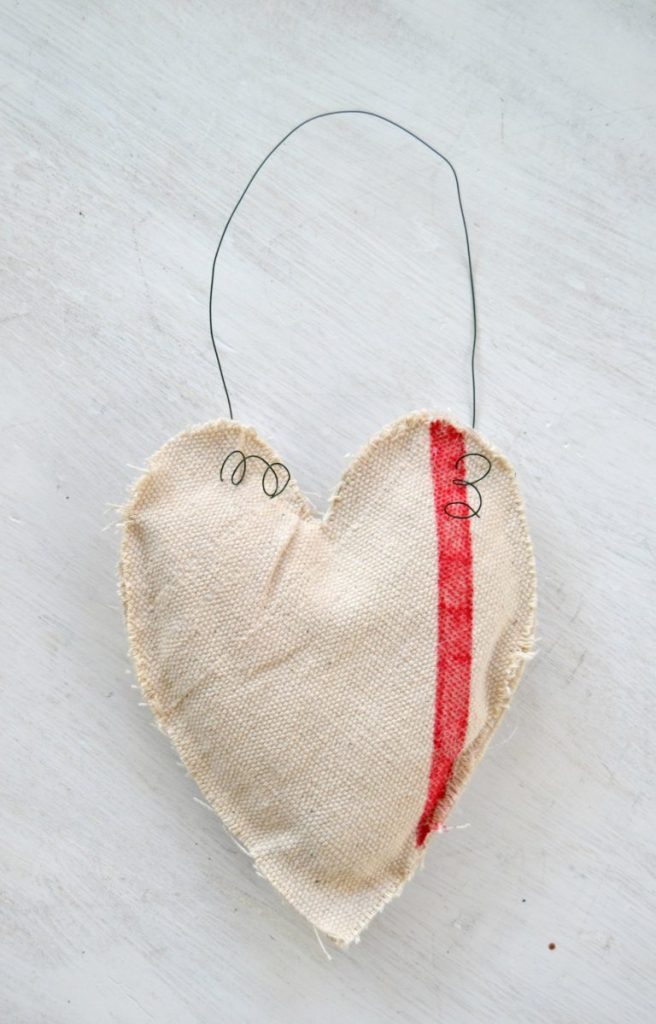 Are you looking for Valentine's Day Decorations? Click over to see how easy it is to make Valentine's Day Decorations from a drop cloth and some other simple supplies. 