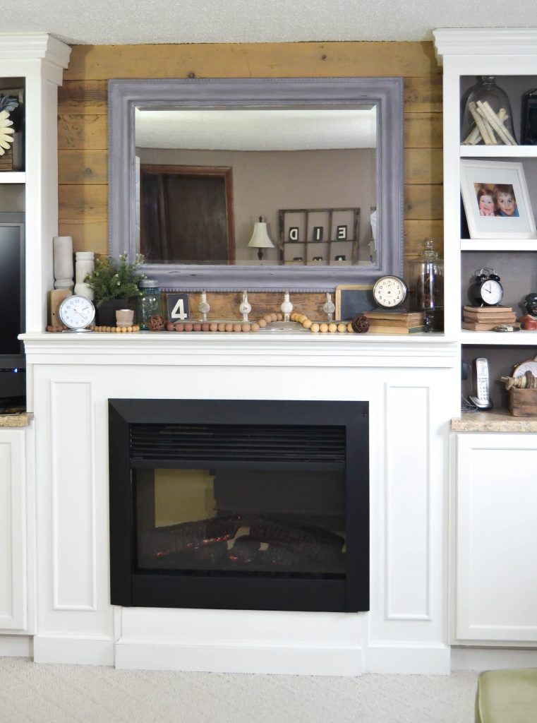 If you like the look of reclaimed barn wood and want to add it to your home, click over and see how we used it to make over our mantel in our family room. 