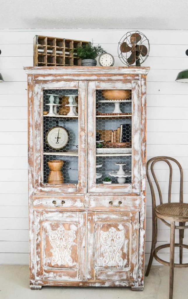 DIY Farmhouse Hutch Makeover - This white farmhouse hutch makeover took this piece from drab to farmhouse fab in no time!