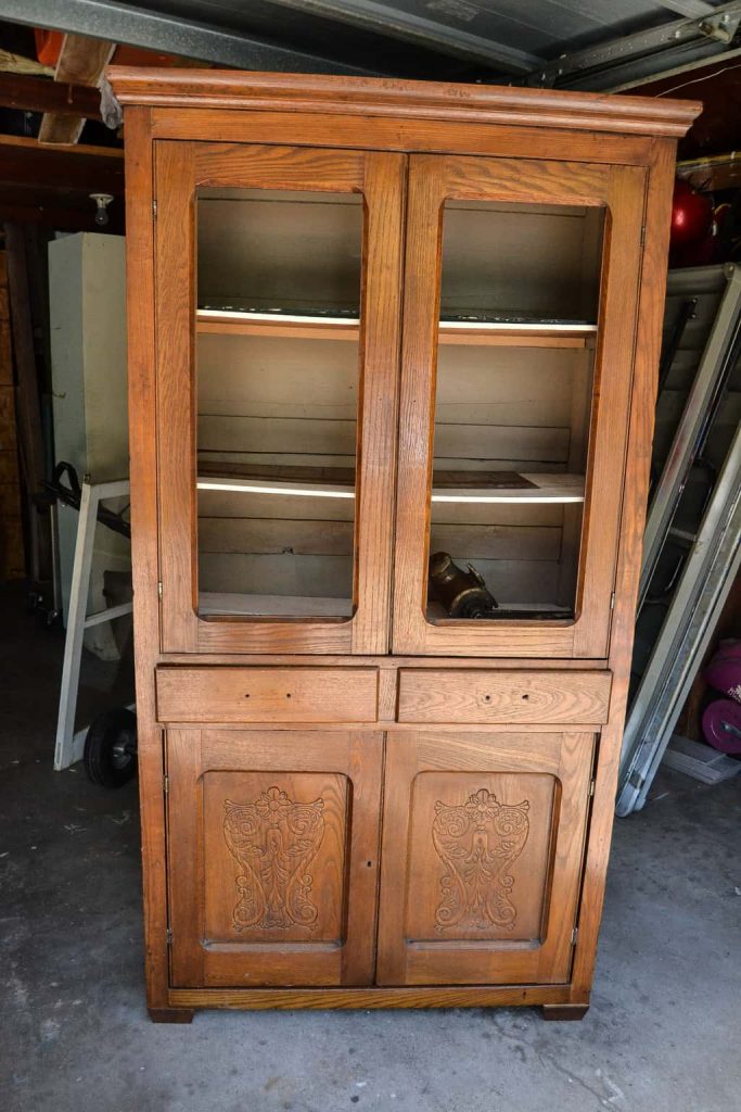 DIY Farmhouse Hutch Makeover - This white farmhouse hutch makeover took this piece from drab to farmhouse fab in no time!