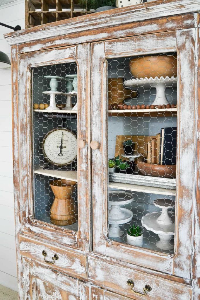 DIY Farmhouse Hutch Makeover - This white farmhouse hutch makeover took this piece from drab to farmhouse fab in no time!