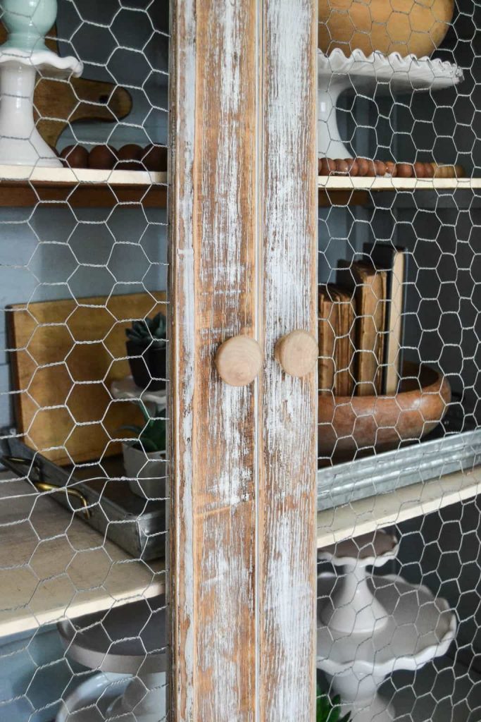 DIY Farmhouse Hutch Makeover - This white farmhouse hutch makeover took this piece from drab to farmhouse fab in no time!