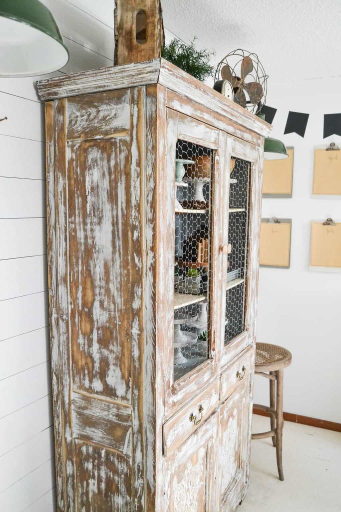 DIY Farmhouse Hutch Makeover - This white farmhouse hutch makeover took this piece from drab to farmhouse fab in no time!