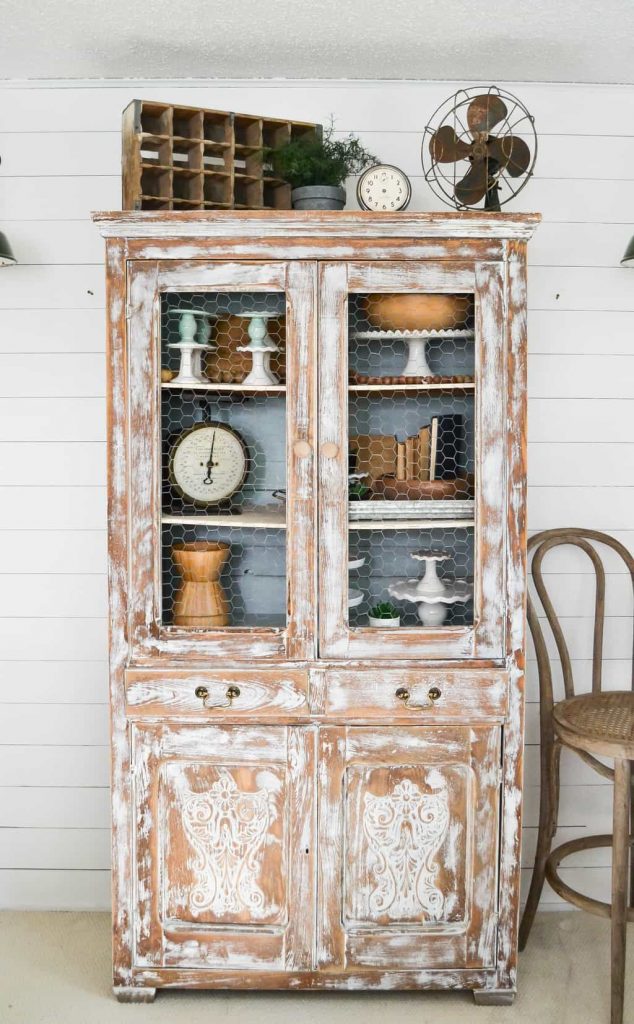 DIY Farmhouse Hutch Makeover - This white farmhouse hutch makeover took this piece from drab to farmhouse fab in no time!