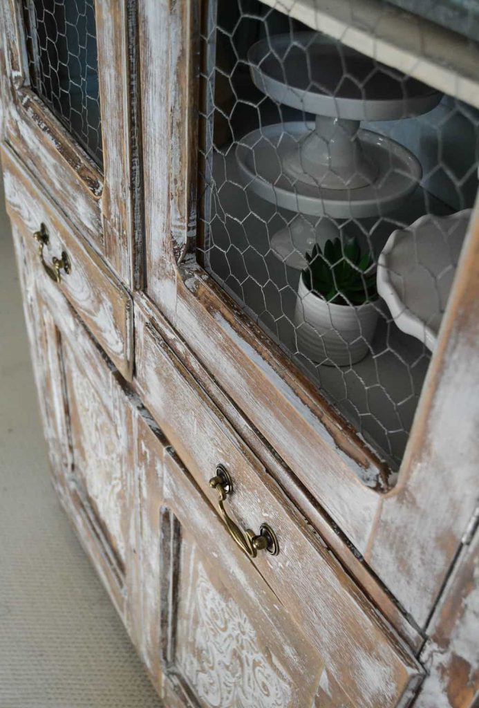 DIY Farmhouse Hutch Makeover - This white farmhouse hutch makeover took this piece from drab to farmhouse fab in no time!