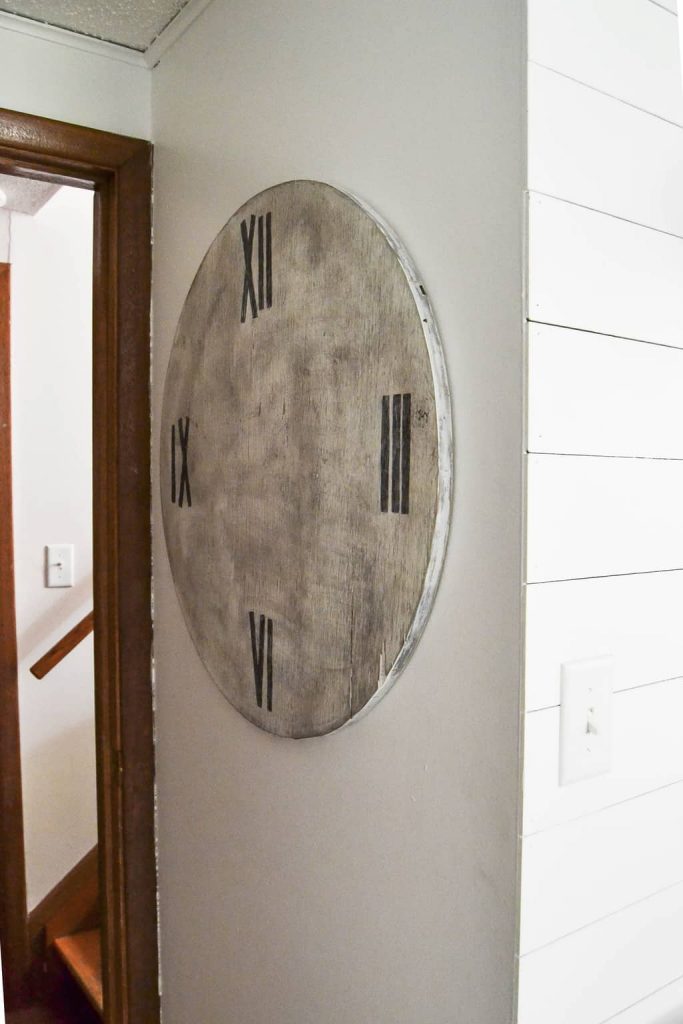 DIY Faux Farmhouse Clock - Love the look of big, wood clocks? Make your own DIY Faux Farmhouse Clock easily!