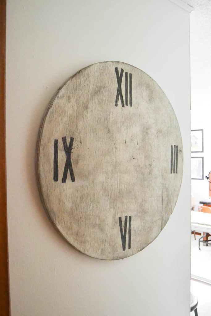 DIY Faux Farmhouse Clock - Love the look of big, wood clocks? Make your own DIY Faux Farmhouse Clock easily!